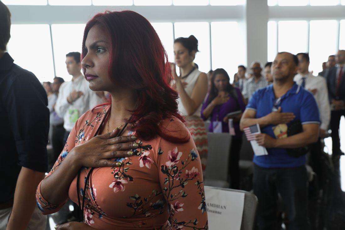 mmigrants listen to the National Anthem at a naturalization ceremony held in the observatory of the One World Trade Center <br>